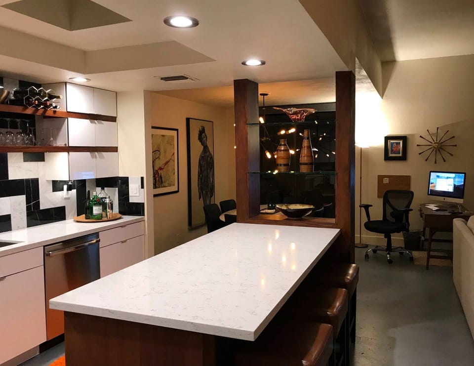 Two skylights and an eight-foot island with custom, glass shelves.