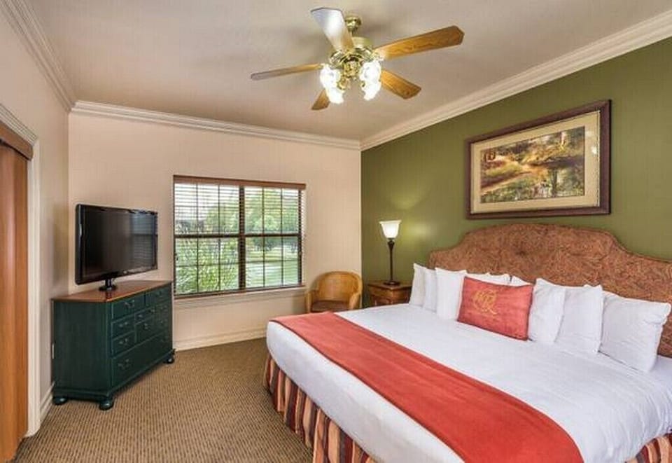 King Size Bed in 1 Bedroom Unit & large Television on Dresser
