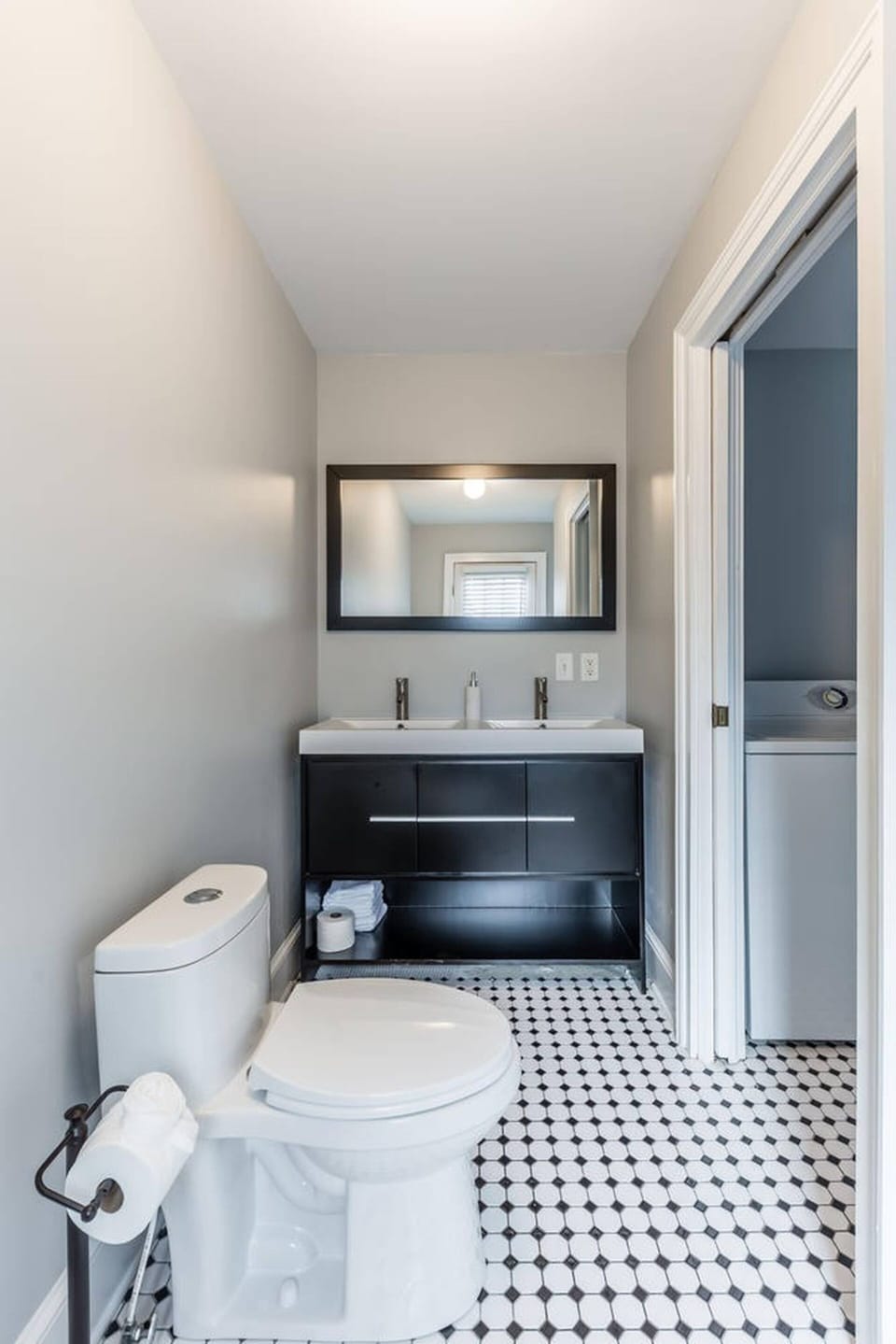 Bathroom #1 with a double sink vanity and a shower/tub 