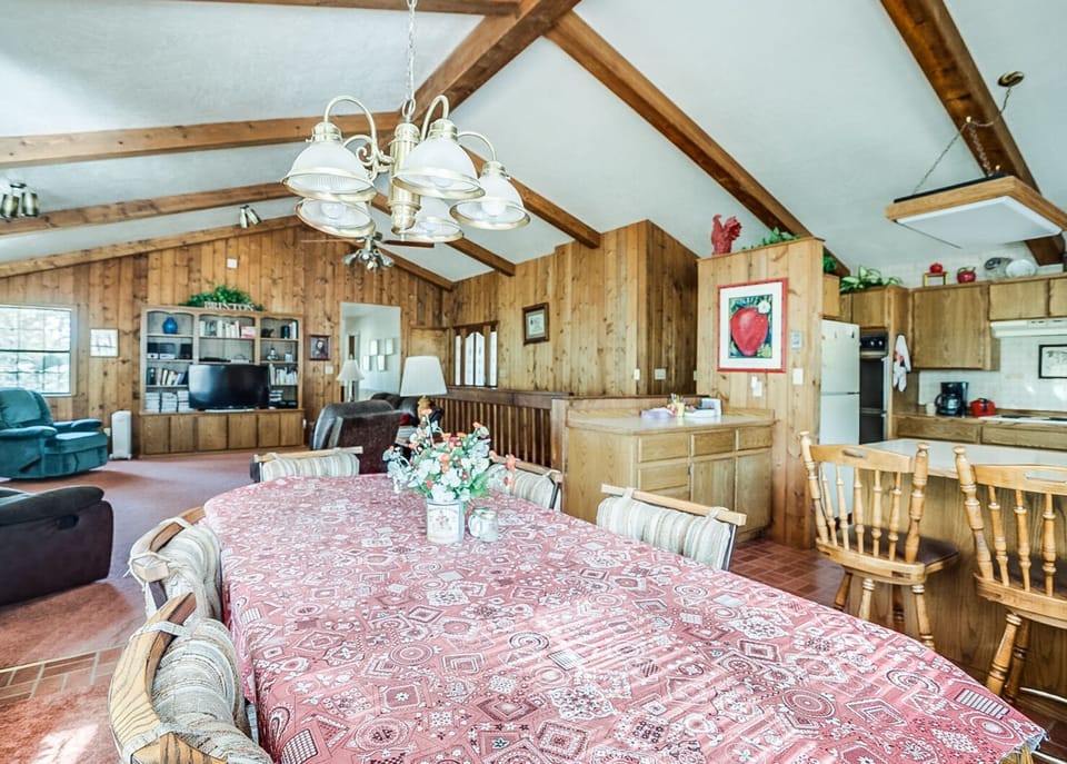 Gather, dine, and unwind in a warm wood-lined cabin made for memories. 