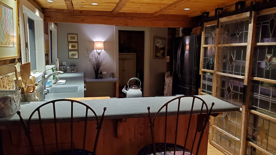 Counter with barstools looking into kitchen