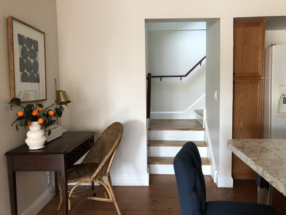 Kitchen Nook w/ desk + stairs to 2nd Floor