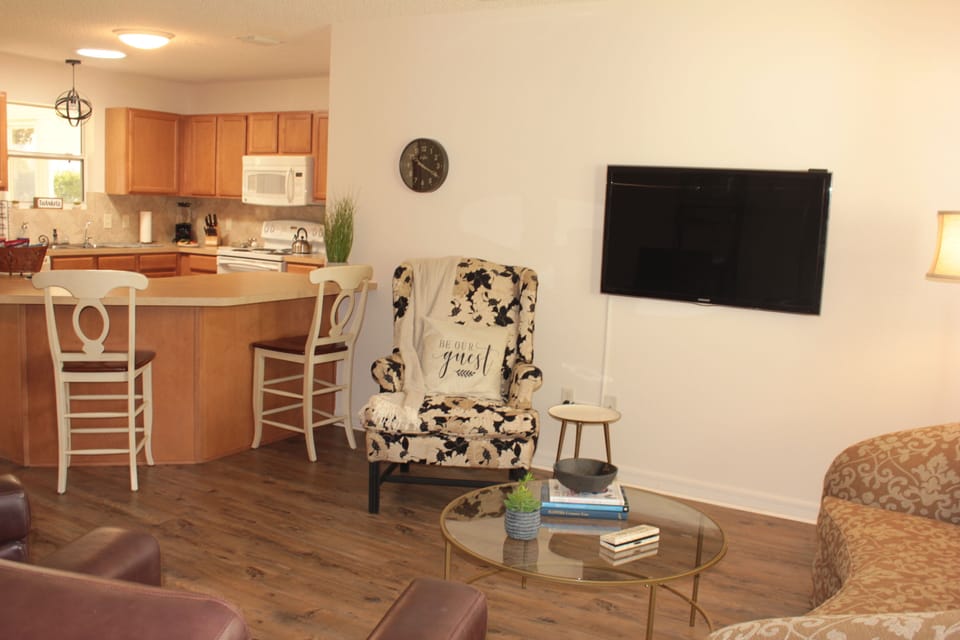 Lots of comfortable seating and a big screen TV.