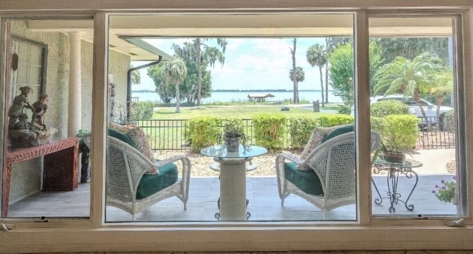 Living room facing the sitting area on porch overlooking beautiful Lake Dora