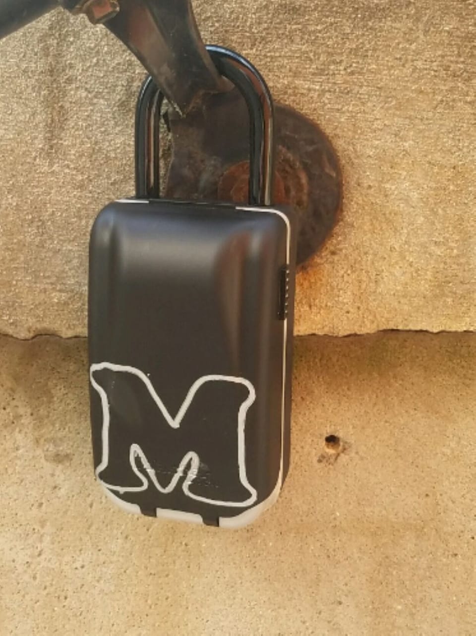 Lockbox located on the left side of the top first step to the basement 