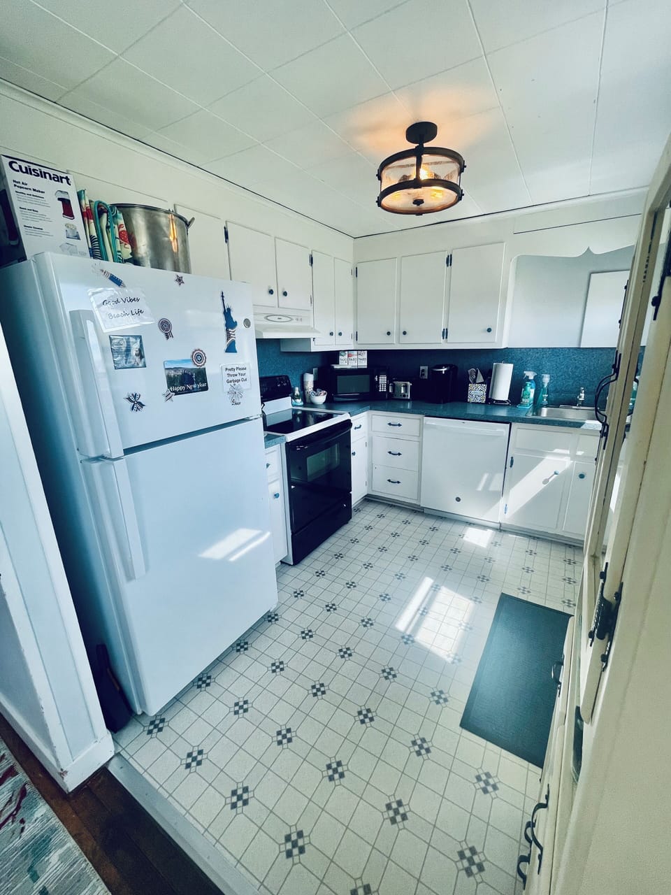 Full kitchen with Stove microwave dishwasher coffee kuerig refrigerator 