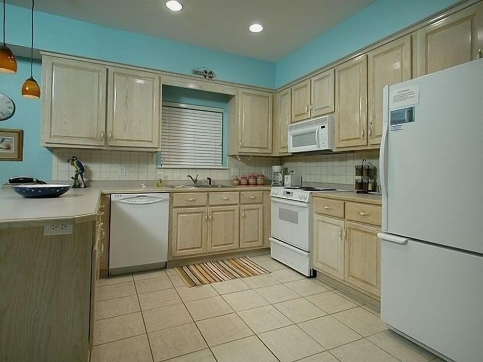 Our spacious kitchen is stocked with everything a chef might desire.