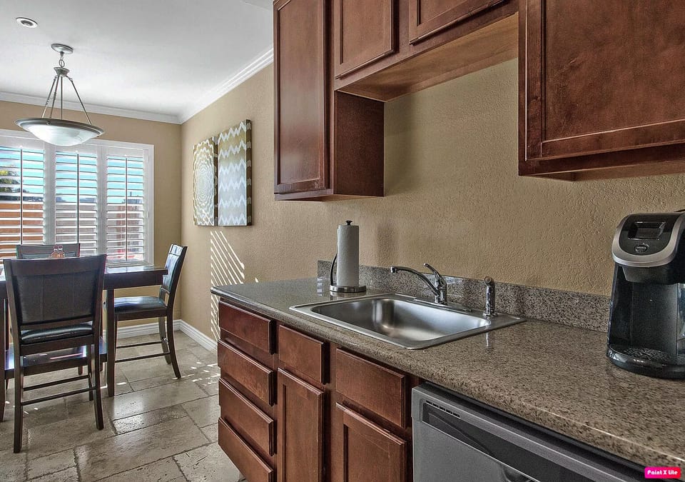 Kitchen with stainless sink & dishwasher.