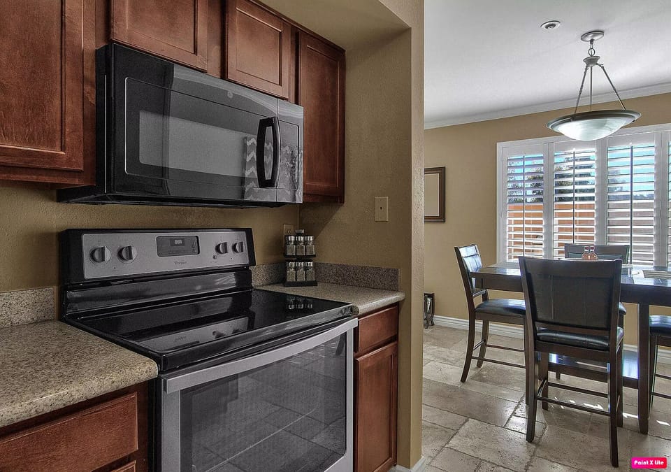 Kitchen with oven/stove range & microwave.