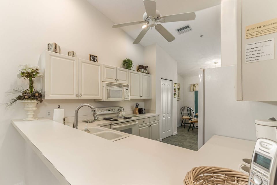 Convenient pass-thru to the formal dining table of 6.  Kitchen also has another cafe table for 4.
