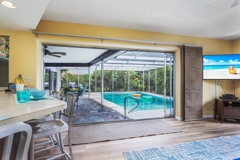 Family room and kitchen open to the patio pool area.....Kitchen has a pass-thru window