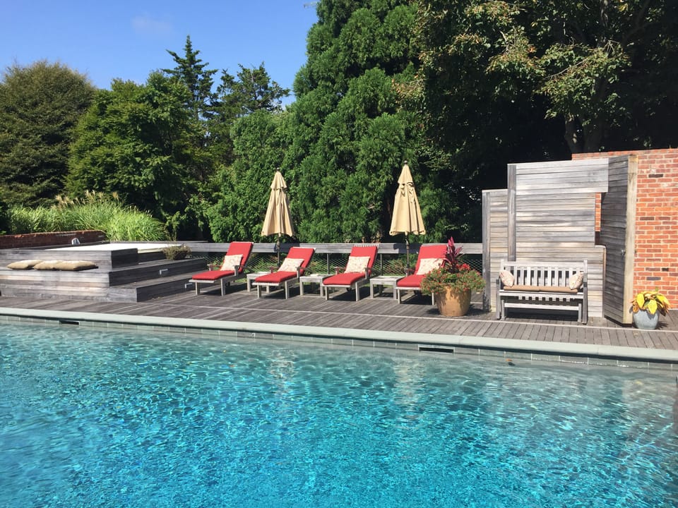 Wake up every day to this beautiful view of our enticing heated pool & gardens