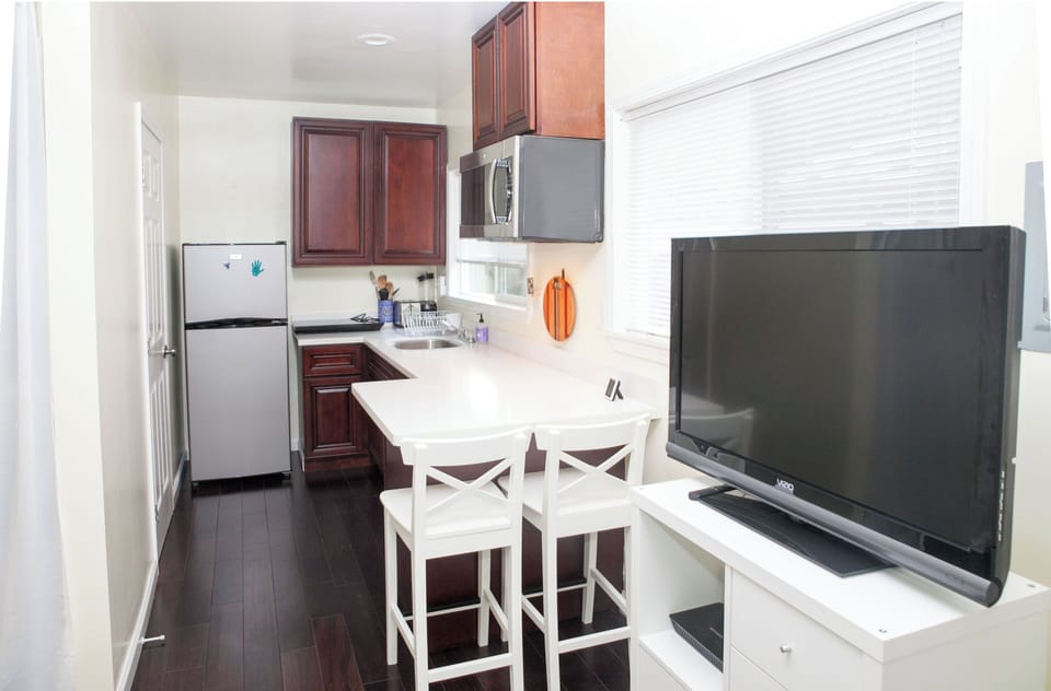 Full kitchen with 2 burner stove top and microwave oven (no full oven/stove top)