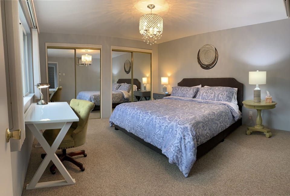 Bedroom with king size bed and desk