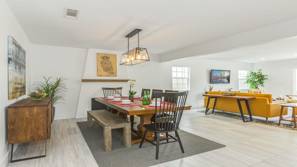 - Dining room with rustic wood table and stylish seating   - Pendant light adds a warm touch for cozy shared meals   - Great space for family dinners or entertaining guests