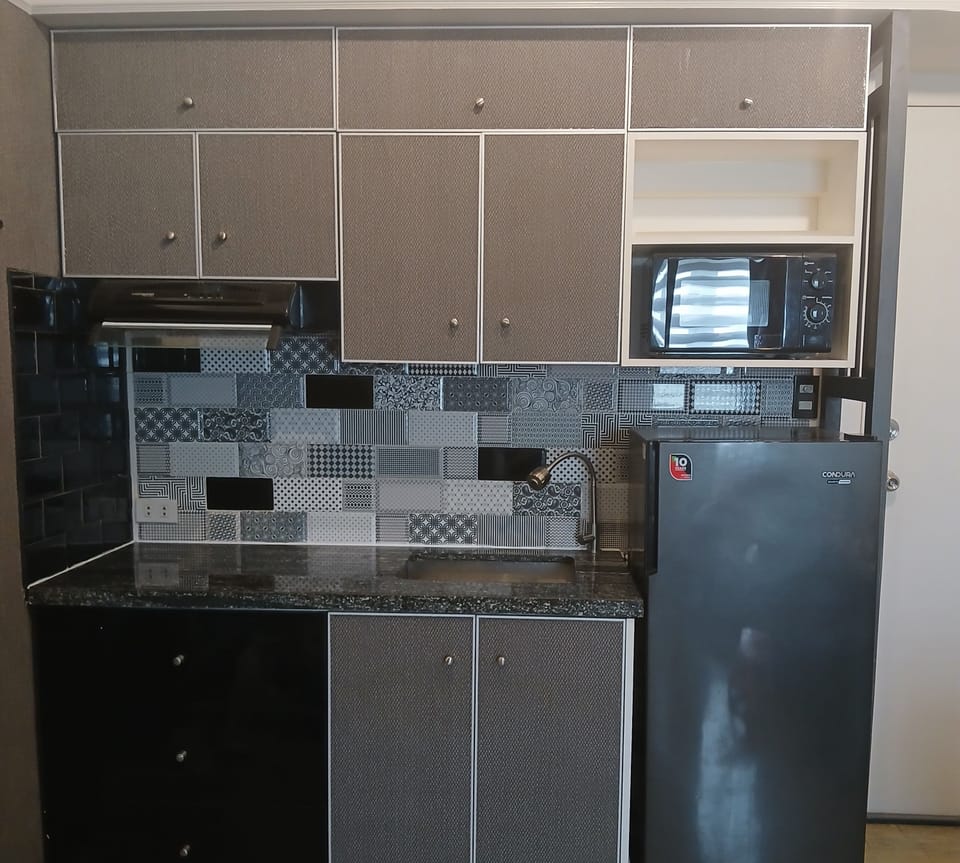 The kitchen is modern and equipped for light meals only.