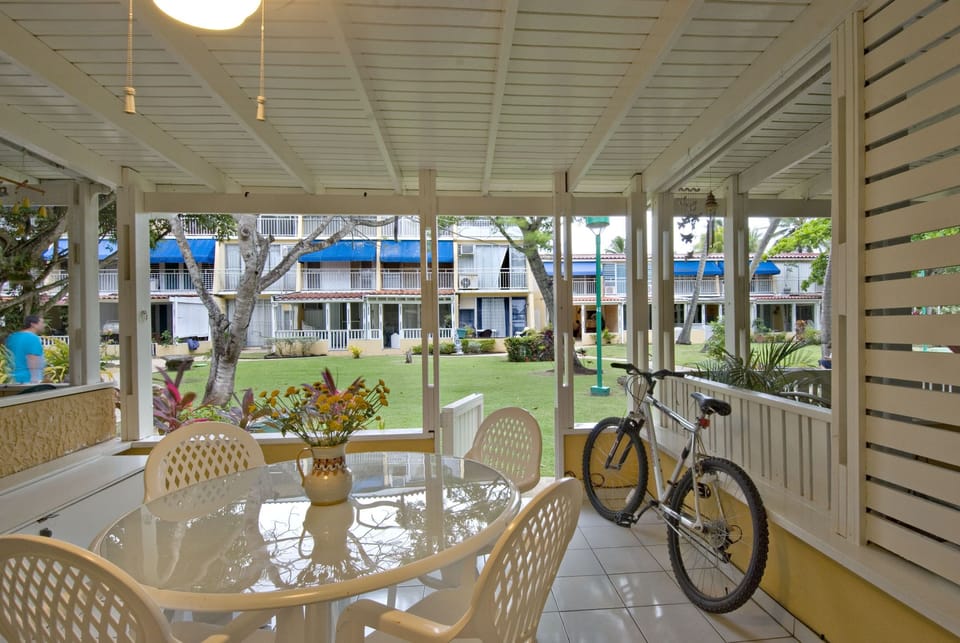 View of front porch and backyard:relaxing to parents, fun for kids.