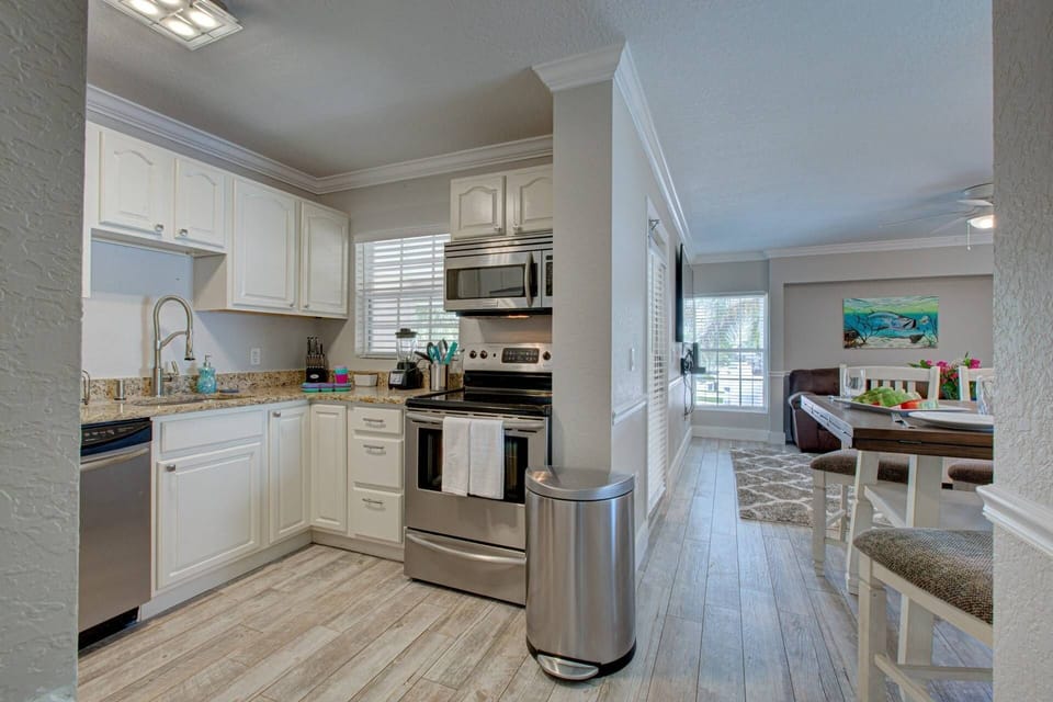 Lovely full kitchen with granite counters and stainless appliances.