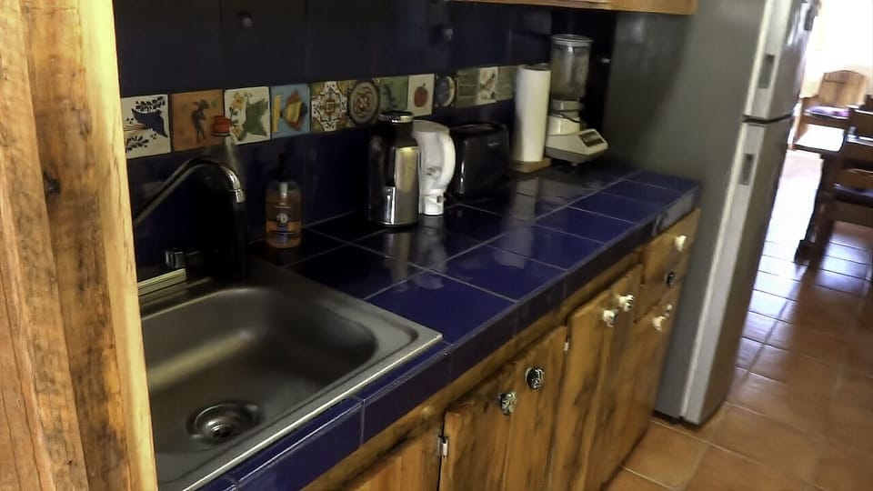 Indoor kitchen (prep area) Fridge, sink with Hot&Cold water, cookware,Dishes