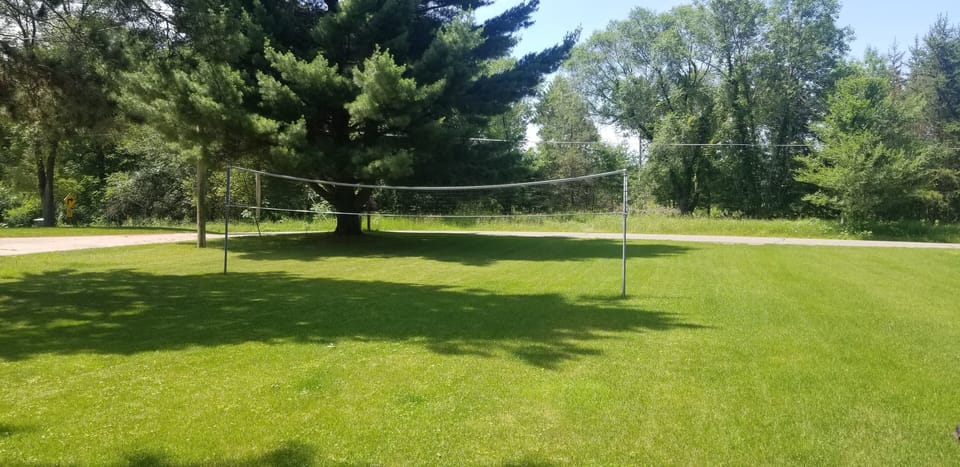 Huge yard for lots of games.  Volleyball is ready to go.  