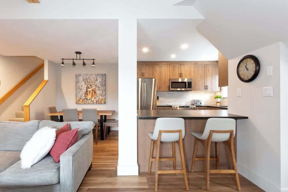 - Open-concept kitchen and living with natural wood and warm accents  
- Breakfast bar with stools perfect for morning coffee or casual meals  
- Ideal blend of comfort and modern mountain-style living  
