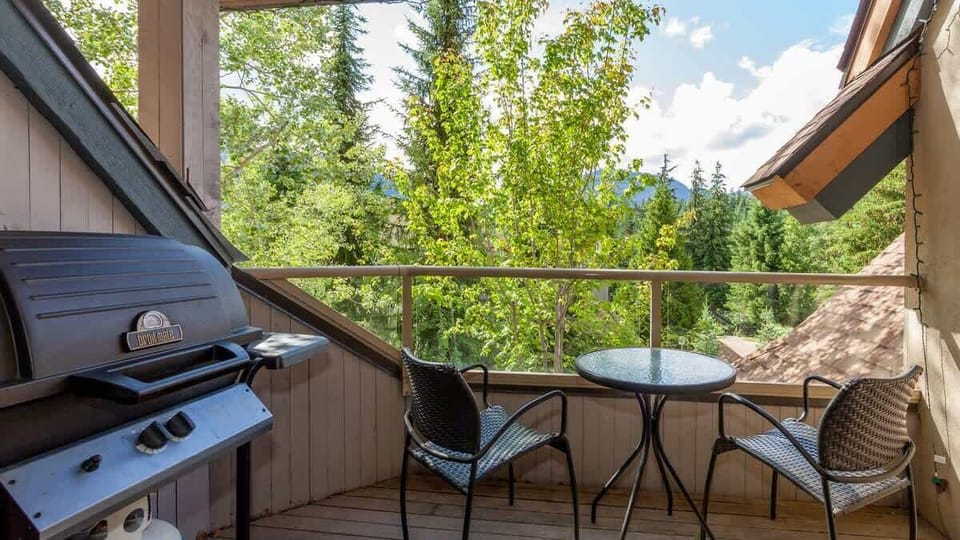 - Private balcony with BBQ grill and forest views for outdoor dining  
- Relax with morning coffee or evening wine under open alpine skies  
- Serene setting surrounded by trees and mountain air tranquility  