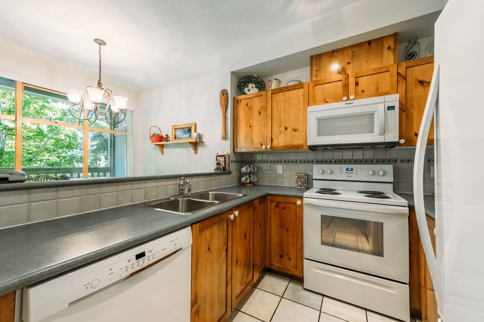 Kitchen - Open area so you can socialize with the family while preparing your next meal.
