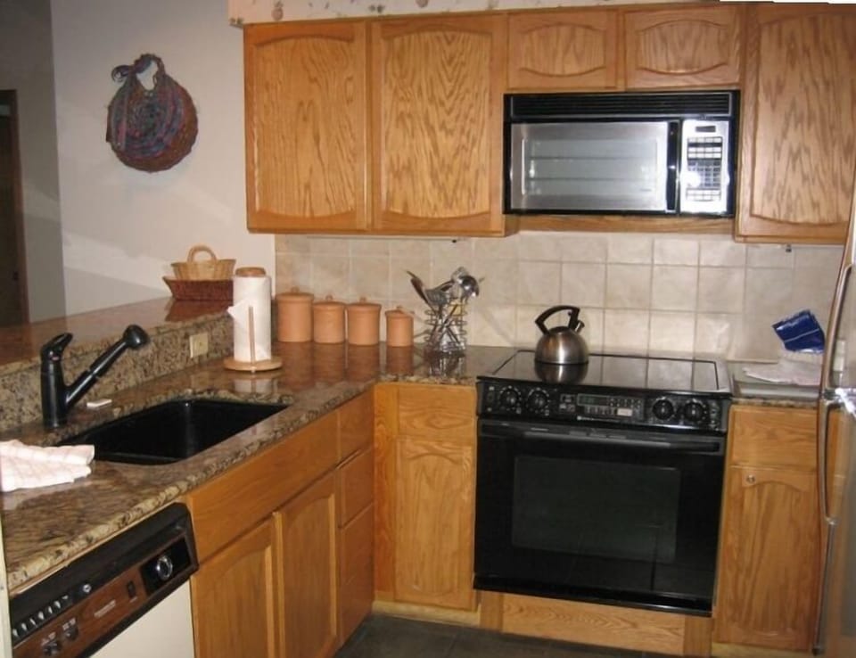 Updated kitchen with granite counters, garbage  disposal,new cabinets.