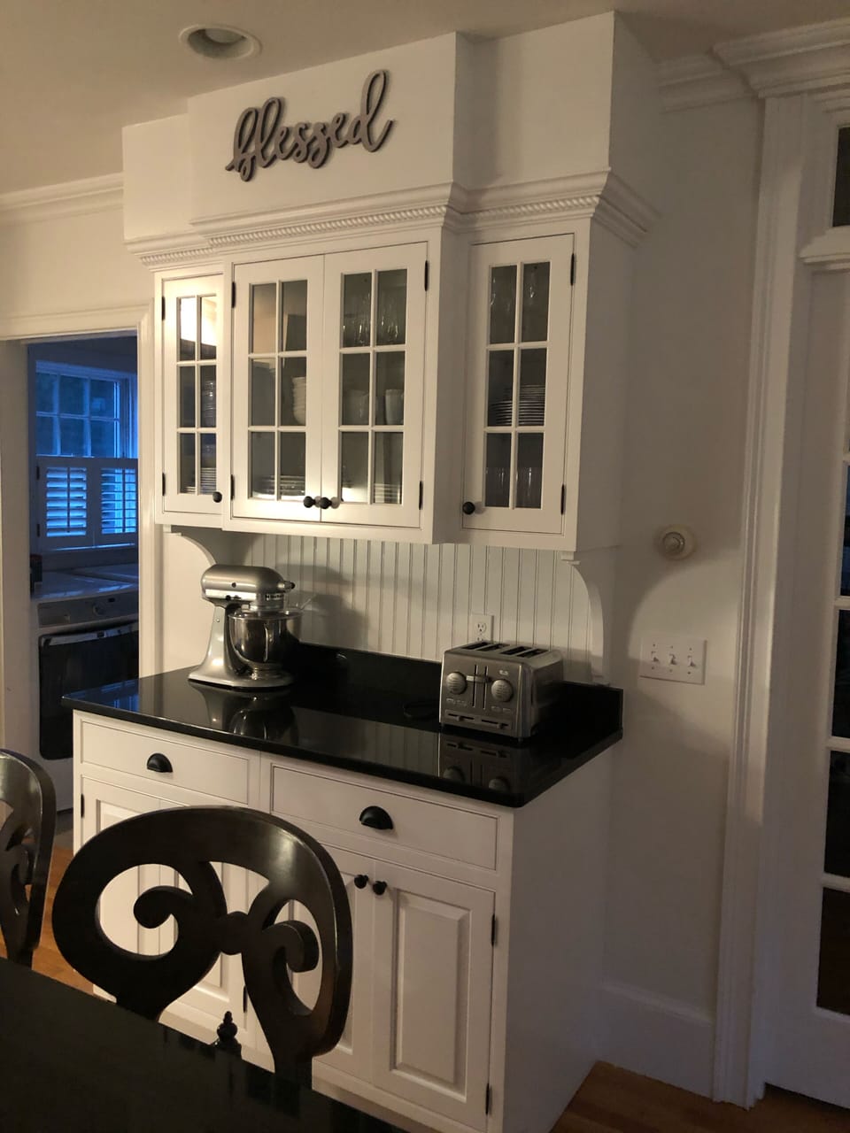 Laundry room with washer and dryer off of kitchen