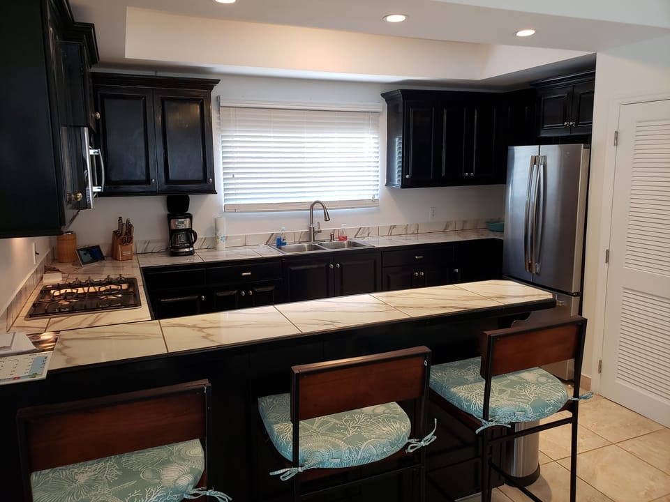 Updated kitchen, well stocked & newer appliances including diswasher, ice maker