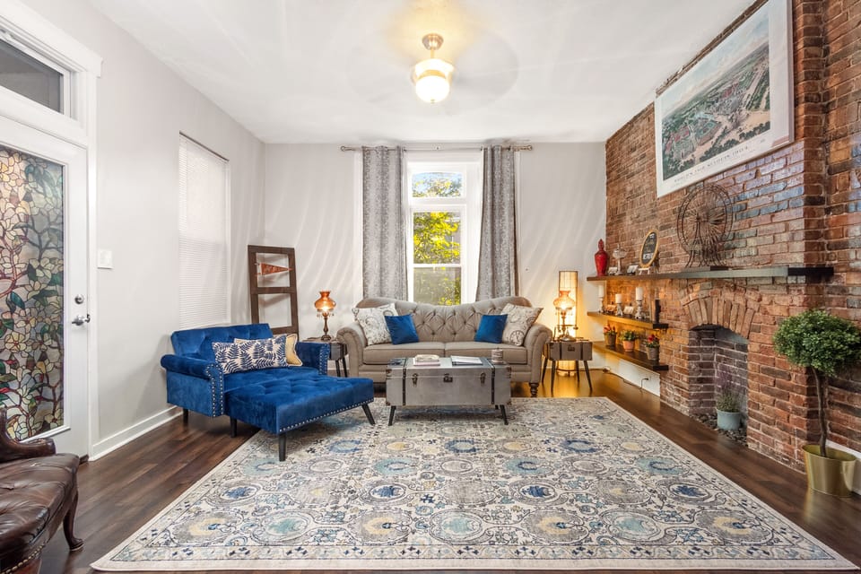 Spacious living room with high ceilings and World’s Fair Decor