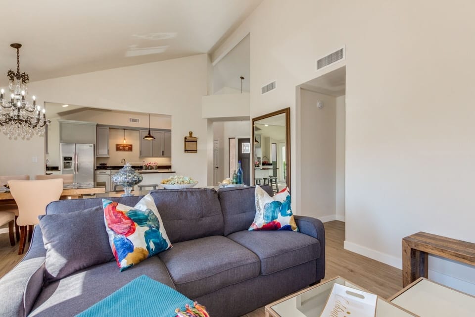 Comfy couch with LARGE TV over fireplace