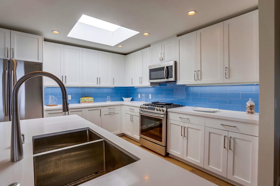 Bright finishes and modern appliances make cooking a pleasure.