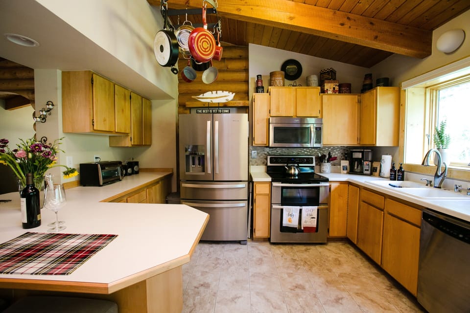 Kitchen Kitchen The kitchen is well stocked, making cooking your favorites easy.