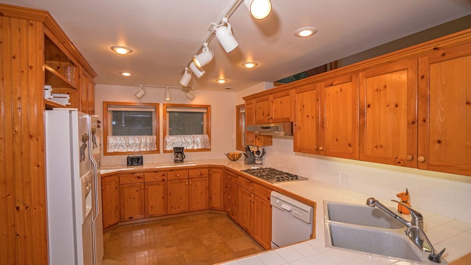 Fully stocked kitchen. New dishwasher, double ovens, gas range