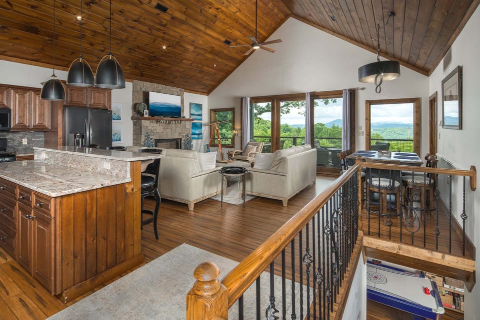 Spacious great room with vaulted ceilings and mountain views