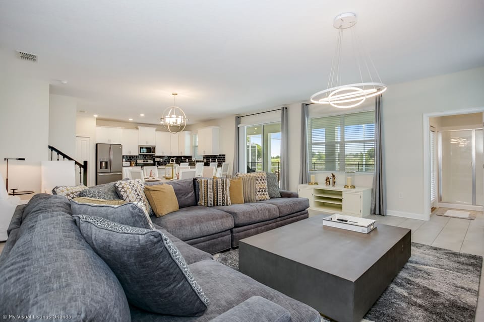 - Enchanting Living Area of the Home in Florida - Plush seating arrangements invite relaxation and stylish gatherings - Open-concept design facilitates seamless flow between living, dining, and kitchen