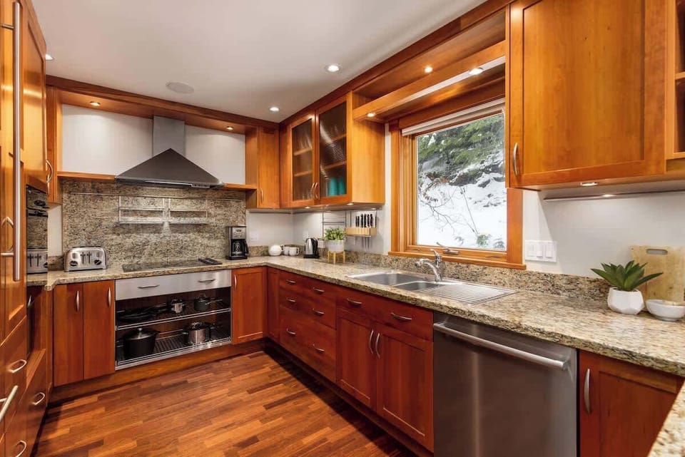 Modern gourmet kitchen with granite counters