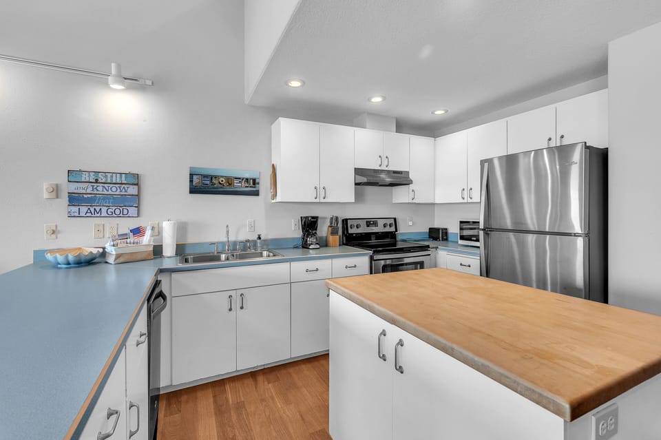 Your fully equipped kitchen features modern appliances and ample counter space for preparing memorable meals during your stay.