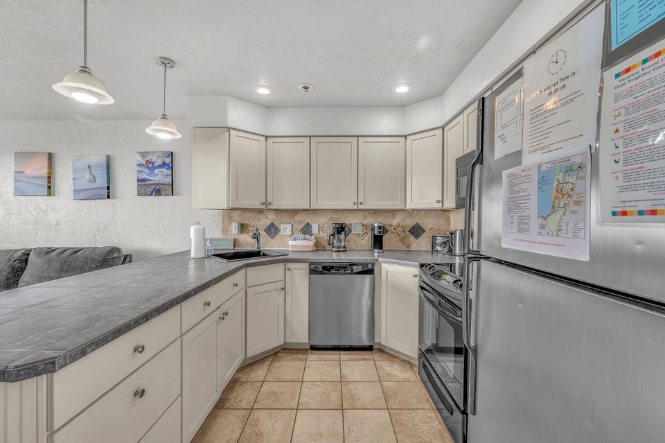 Your fully-equipped kitchen invites culinary adventures with granite counters, stainless appliances, and everything needed for memorable meals.