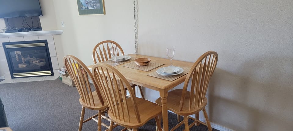 Gather around your private dining table set for memorable meals, with a cozy fireplace nearby to warm your evenings and create that perfect home-away-from-home atmosphere.