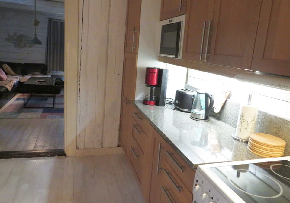 Large kitchen with granite counter tops. Full size fridge with freezer. 