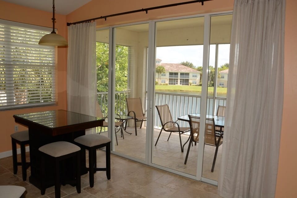 Eating area with view of lanai. New lanai screens. Very bright.