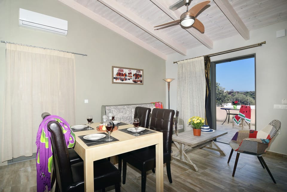 Living room with view at the veranda and garden 