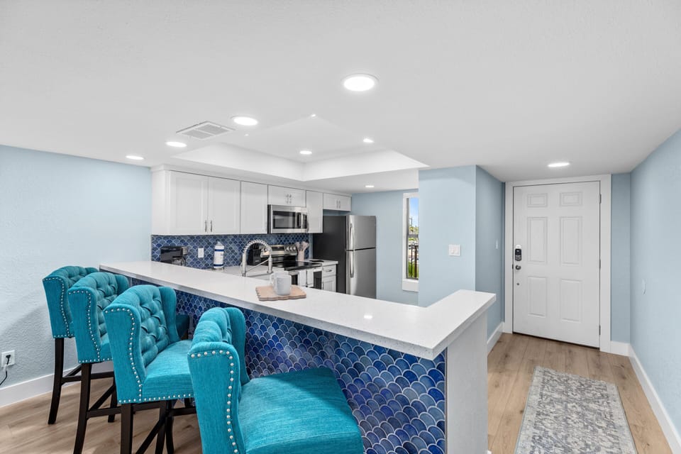 Kitchen bar has extra seating for up to 4!