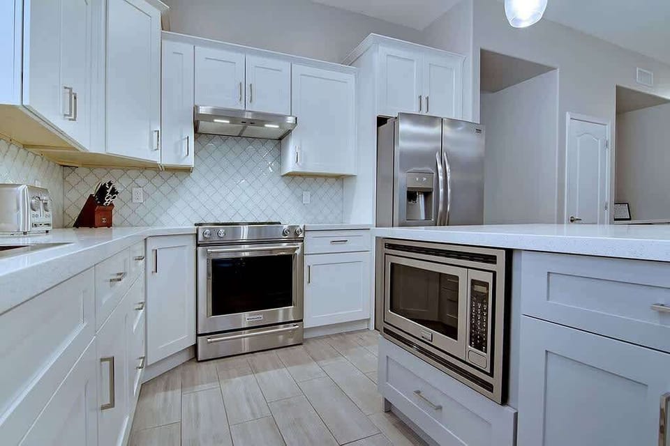 Prepare your meals in the well-equipped kitchen with top-notch stainless appliances.