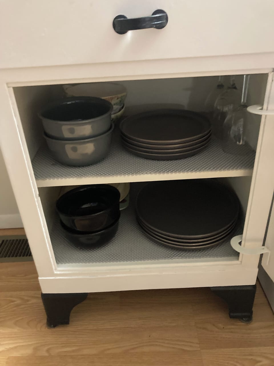 Dishes in lower cabinet.