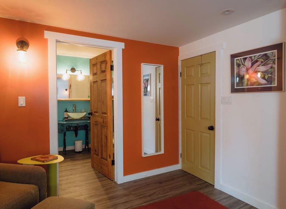 Welcoming hallway with vibrant warm tones and tasteful decor throughout