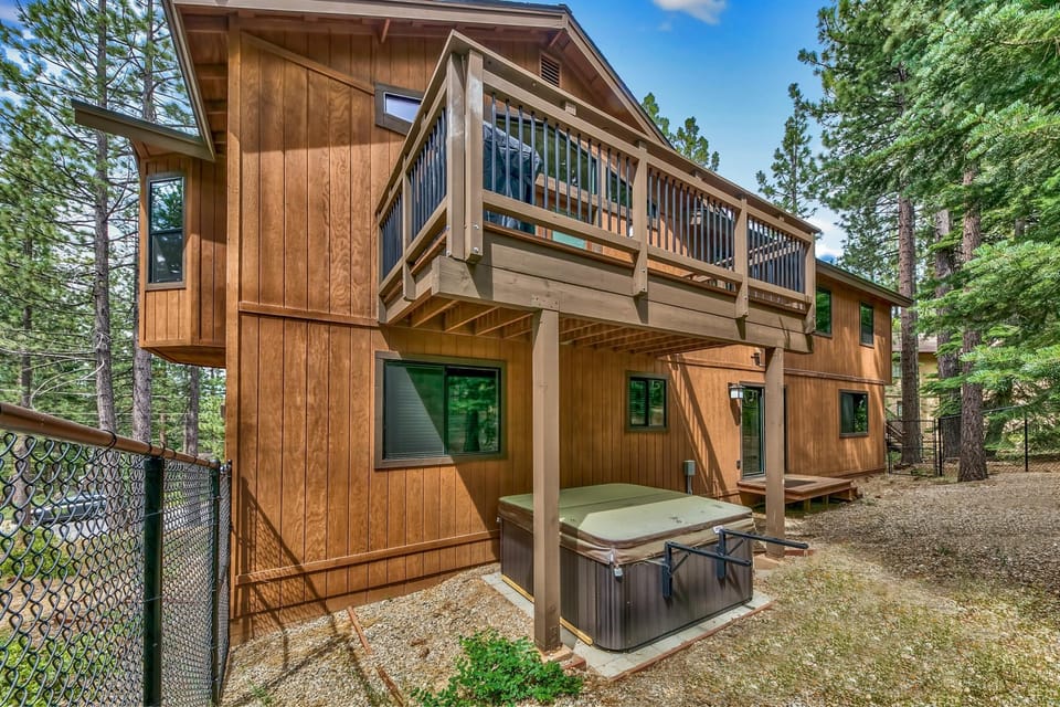 Secluded backyard retreat with spacious deck and hot tub