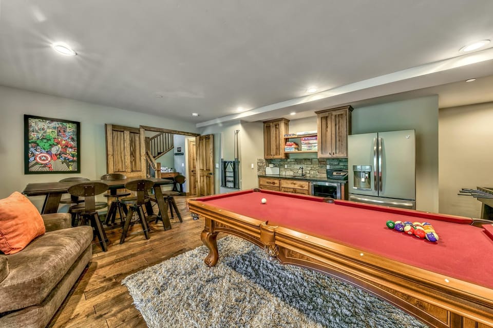 Spacious game room with pool table and cozy seating area